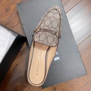 New, in original box. Coach Irene Jacquard Mule shoes in Oak/Maple